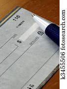 Writing a check to pay for the bill