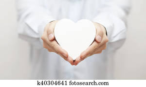 White heart in hands White heart in hands