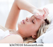 Tired woman sleeping on a bed 