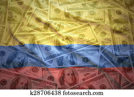 colorful waving colombian flag on a american dollar money background colorful waving colombian flag on a american dollar money background