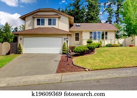 House exterior. View of entrance porch and garage