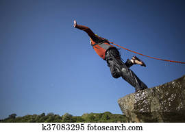 Jump off a cliff with a rope.