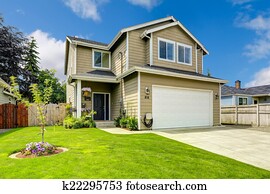 Two story house exterior with front yard landscape