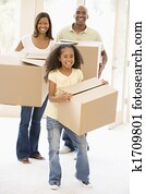 Family moving into new home smiling