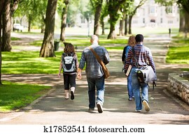 University Students Walking On Campus Road University Students Walking On Campus Road