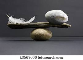 feather and stone balance