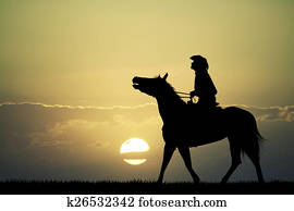 man on horse at sunset man on horse at sunset
