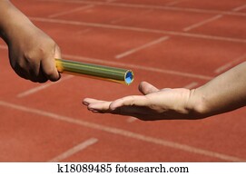 Relay-athletes hands sending action.