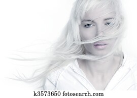 beautiful blonde girl fashion wind long hair over white