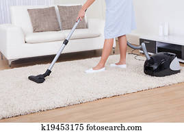 Maid Cleaning Carpet With Vacuum Cleaner Maid Cleaning Carpet With Vacuum Cleaner