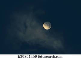moon in night skies covered by the cloud. Monochrome