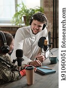 Man interviewing the woman in studio