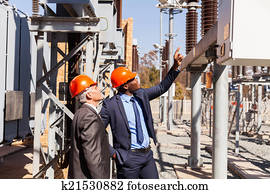 managers inspecting electricity power plant managers inspecting electricity power plant