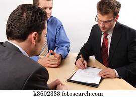 Businesspeople signing a contract