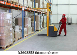 manual forklift operator at work in