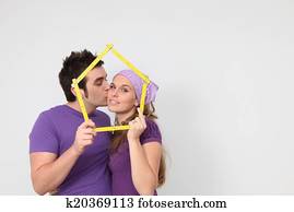 affectionate couple getting mortgage loan for new house concept