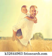 Happy father and son having fun outdoors