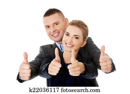 Business couple showing thumbs up