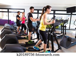 Aerobics elliptical walker trainer group at gym Aerobics elliptical walker trainer group at gym