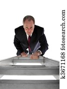Businessman climbing a ladder