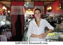 small business: proud female owner of a cafe small business: proud female owner of a cafe