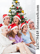 Extended family singing christmas carols