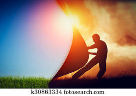 Man pulling curtain of darkness to reveal a new better world. Change.