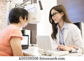 optometrist woman fotosearch visit
