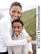 African-American mother and son at beach