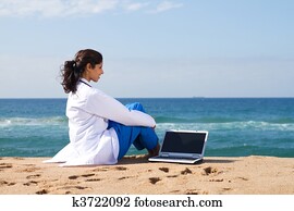 doctor relaxing on beach 