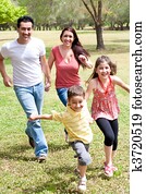 Family playing in the green field