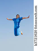 young nurse jumping in air