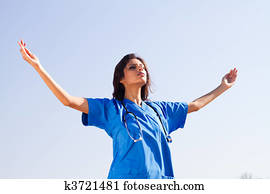 young spiritual nurse on beach