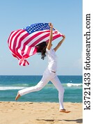 young woman holding american flag 