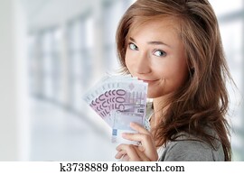 Woman holding euros bills