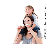 Cheerful mother giving piggyback ride to her daughter 