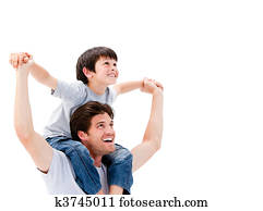 Joyful father giving piggyback ride to his son