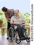 elderly man out for walk in wheelchair