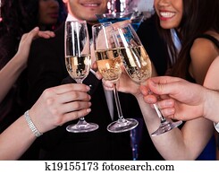 Friends Toasting Champagne At Nightclub