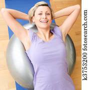 Jolly woman doing exercice at home