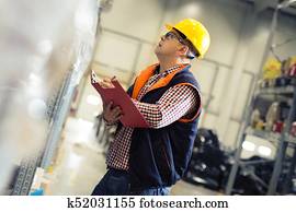 Manager In Warehouse. wholesale, logistic, people and export concept Manager In Warehouse. wholesale, logistic, people and export concept