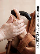 Adult helping senior in hospital