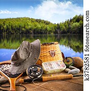 Fly fishing equipment near a lake Fly fishing equipment near a lake