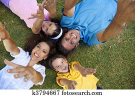Father Mother Son and Daughter Family Laying Down Hands Up