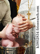 baby baptism with water in font baby baptism with water in font