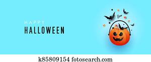 Halloween pumpkin decorations with striped candy and a bat on a blue background Halloween pumpkin decorations with striped candy and a bat on a blue background