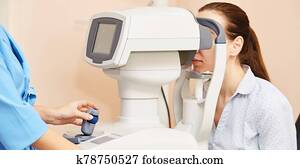 ophthalmologist doctor in exam optician laboratory with female patient. Eye care
