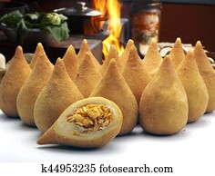 Coxinha de Galinha - Brazilian deep fried chicken snack, popular at local parties. Served with chili sauce.