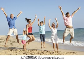 Portrait Of Three Generation Family On Beach Holiday Jumping In Air Portrait Of Three Generation Family On Beach Holiday Jumping In Air