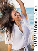 Dancing Woman with Flying Hair at the Beach